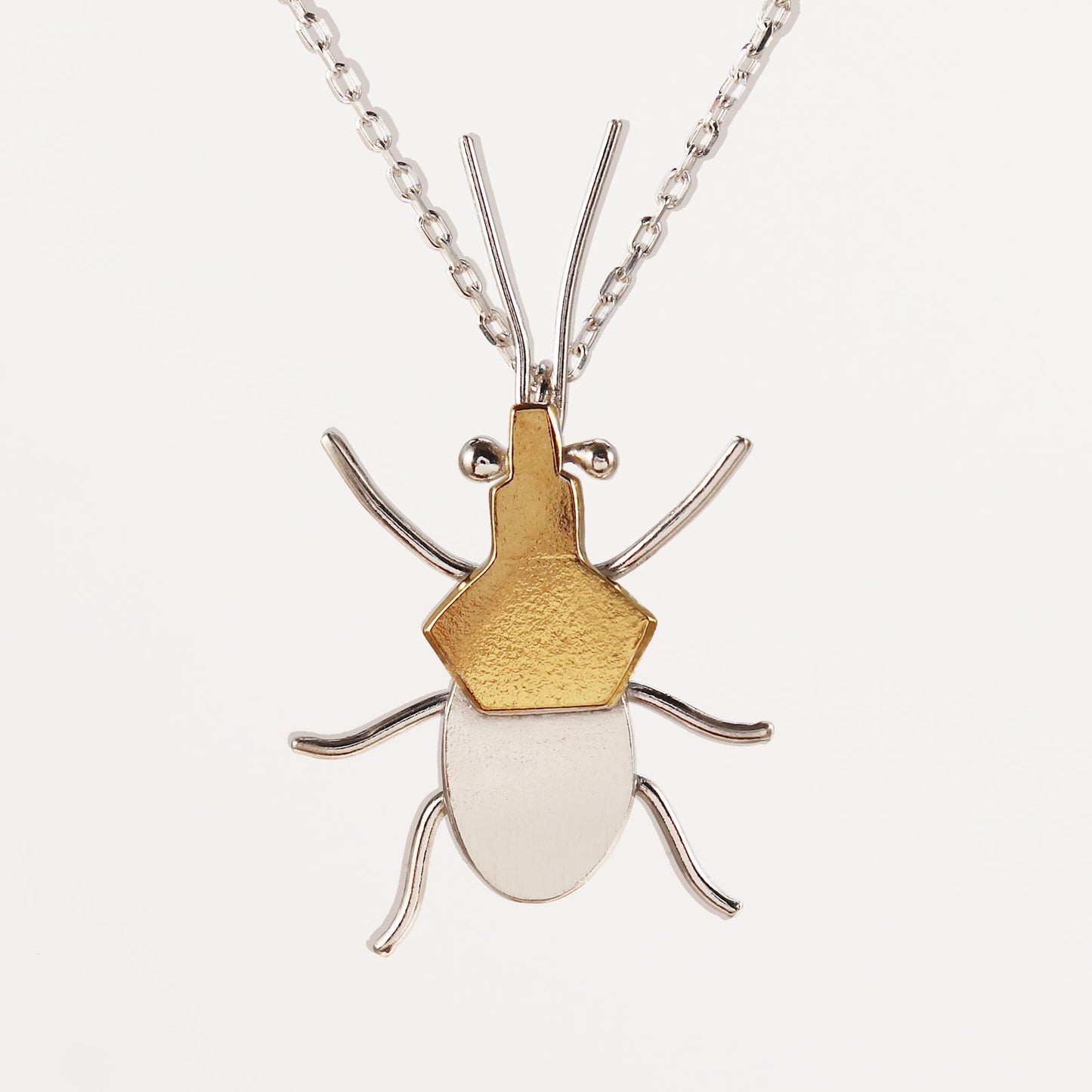 Assassin bug necklace, silver and gold